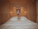 Chambre a coucher en epicea brosse, teinte et cire, avec sculptures d'edelweiss
